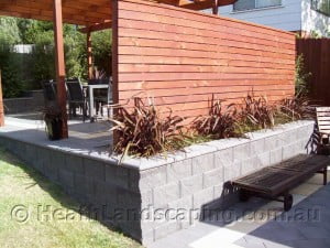 Palawan wooden slat screen, retaining wall and native planting by Heath Landscaping construction Tasmania